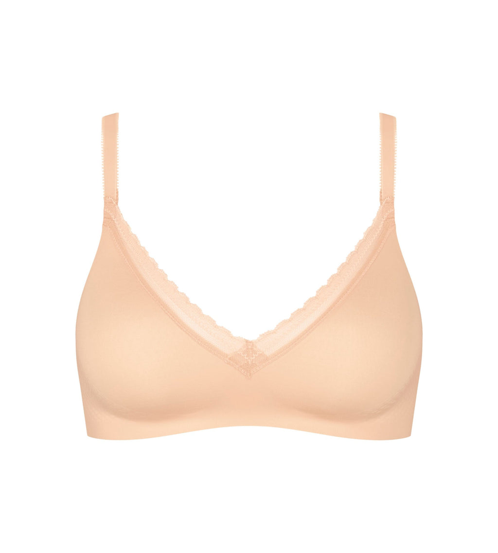 Product-only view of the Sloggi Body Adapt Twist soft bra in powder orange, highlighting the mesh neckline and wire-free construction. Find Now Online