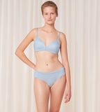 Triumph Body Make-Up Soft Touch light blue hipster panty model full front view, highlighting the seamless finish and soft fabric. Available Online at Blue Salon Qatar