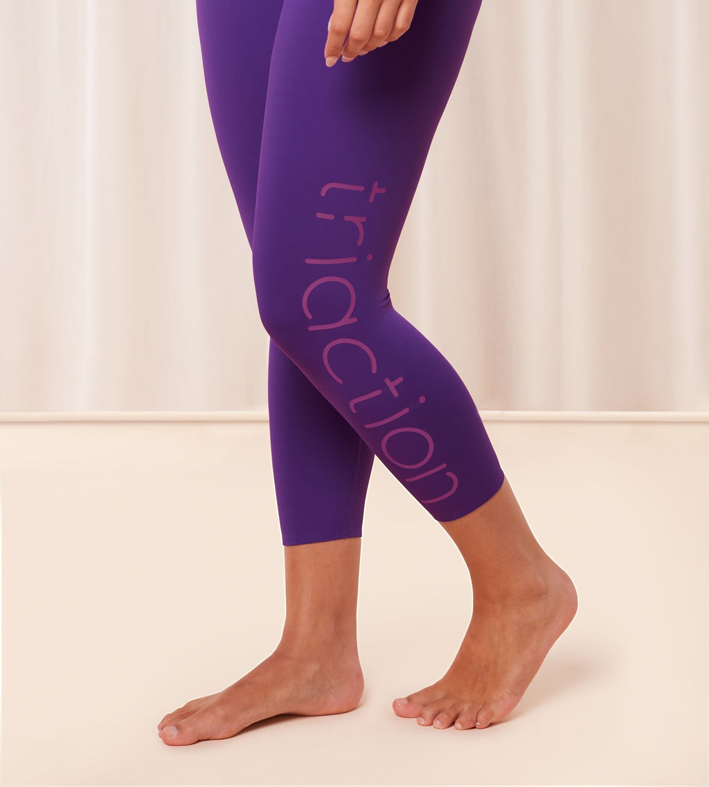 Triumph Cardio RTW high waist purple sports leggings model side view, showing the supportive waistband and sleek performance fabric. Available for Online Purchase